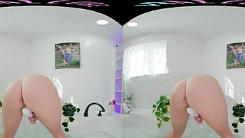 Big tits babe enjoys a sensual VR experience in a bath