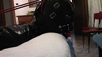 BDSM couple indulges in oral pleasure with a big cock and gagging