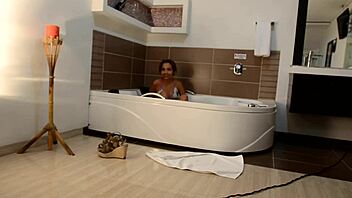 i see this colombian amateur masturbating in her bathtub wearing a bikini, oh god.
