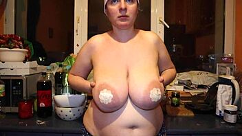 A woman tries on nipple pasties showcasing her natural big tits and boobs