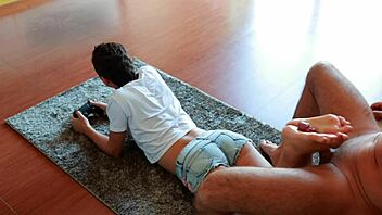 Gamer girl gives footjob while playing NFS