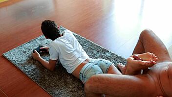 Gamer girl gives footjob while playing NFS