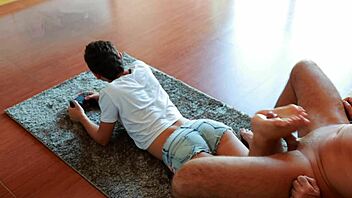 Gamer girl gives footjob while playing NFS