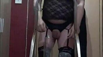 Bisexual sissy enjoys the taste of his own urine while standing on a ladder