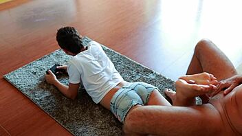 Gamer girl gives footjob while playing NFS