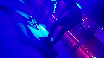 Go-go dancer pulls brunette to dance