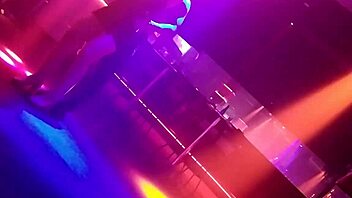 Go-go dancer pulls brunette to dance