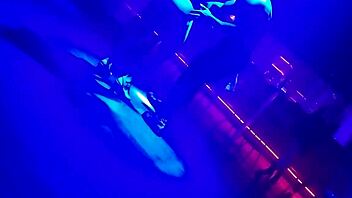 Go-go dancer pulls brunette to dance