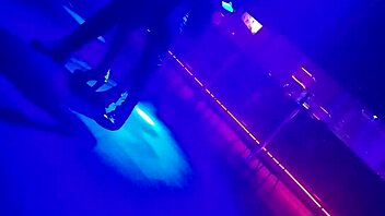 Go-go dancer pulls brunette to dance