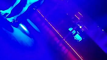 Go-go dancer pulls brunette to dance