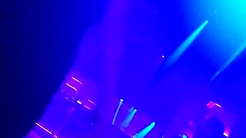 Go-go dancer pulls brunette to dance