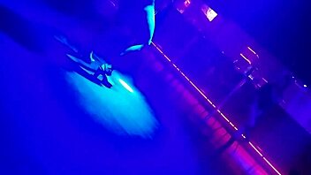 Go-go dancer pulls brunette to dance