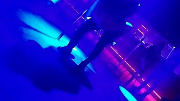 Go-go dancer pulls brunette to dance