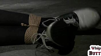 BDSM lesbian strapon sex with clamps and dildo