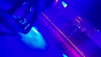 Go-go dancer pulls brunette to dance