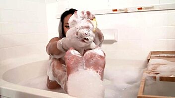 Channy Crosfire soaping her sexy soles for your pleasure