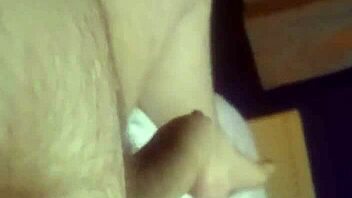 guy wanking his cock until he cums hard on himself