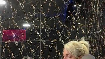 blonde performs handjob in jacuzzi with instructions