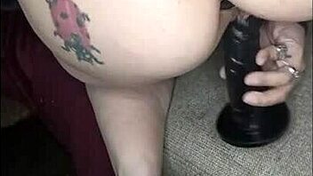 Masturbation with a dildo and butt plug for solo play