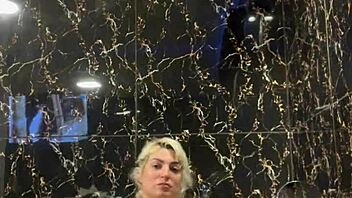 blonde performs handjob in jacuzzi with instructions