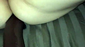 Feeling intense pleasure as she squirts with dildo toy