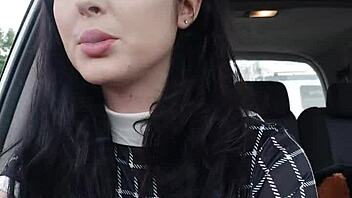 Clothed European brunette smokes in car