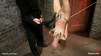 blond suspended upside down, whipped hard in kinky bondage play