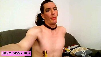 Sissy boy endures BDSM nipple teasing session.
