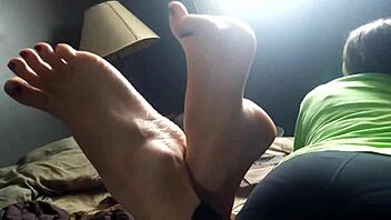Mature woman with high arches shows off her feet and soles
