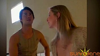 Interracial couple indulges in steamy fingering and boob play
