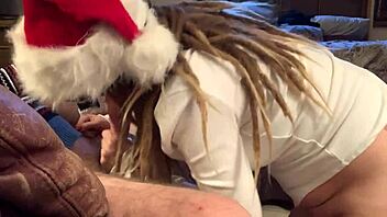 a cute masked girl in stockings enjoys holiday sucking