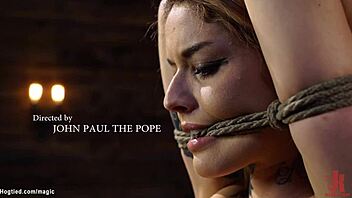 Tattooed latina bound and restrained with toys.