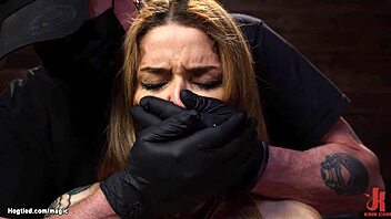 Tattooed latina bound and restrained with toys.