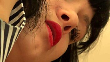 Red-lipped brunette smokes and sucks a rubber cock before getting anal pounded in an amateur gay video