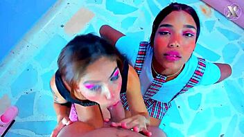 Two latinas kneel for blowjobs
