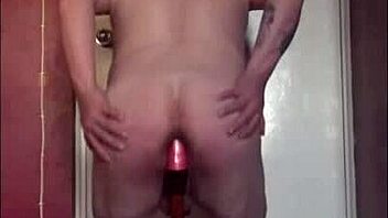 Mark Wright, a bisexual man, indulges in self-pleasure by inserting a dildo into his own anus and simultaneously swallowing his own urine.