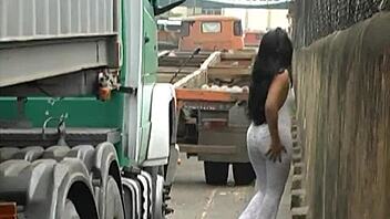 brunette babe flaunts her ass and tits outdoors in santos port