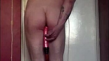 Mark Wright, a bisexual man, indulges in self-pleasure by inserting a dildo into his own anus and simultaneously swallowing his own urine.
