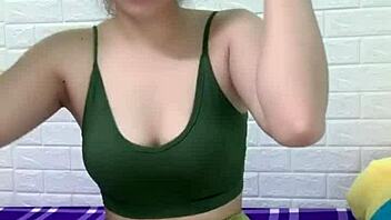 asian girl cooks white rice at home