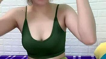 asian girl cooks white rice at home