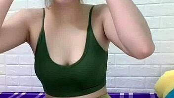 asian girl cooks white rice at home