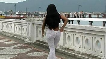 brunette babe flaunts her ass and tits outdoors in santos port