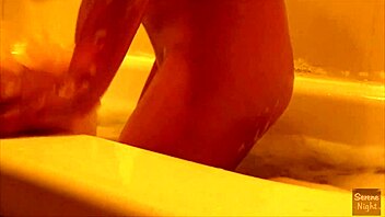 latina babe enjoys bath time with her big tits on display