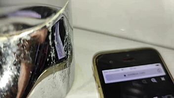 Gardener discovers boss's iphone and goes to bathroom after finding her page on videos while she washes dishes