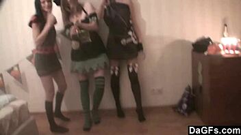 Three teen lesbians in costumes engage in Halloween party fun