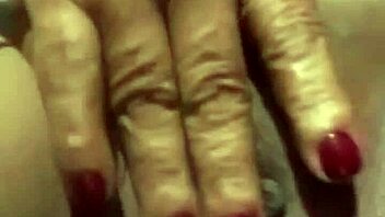 A mature latina engages in a messenger video chat session.