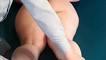 Tied submissive wife is tickled hard with hairbrush, her body writhing in pleasure and pain.