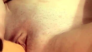 Stunning babe in lingerie and stockings teases with solo play action!