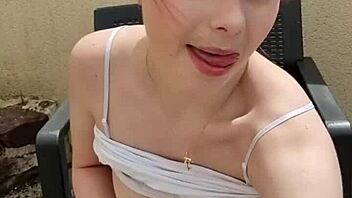 Tattooed temptress teases with tongue and tits outdoors