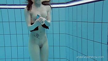 Underwater Slut Roxalana Cheh Strips Naked in Pool Scene
